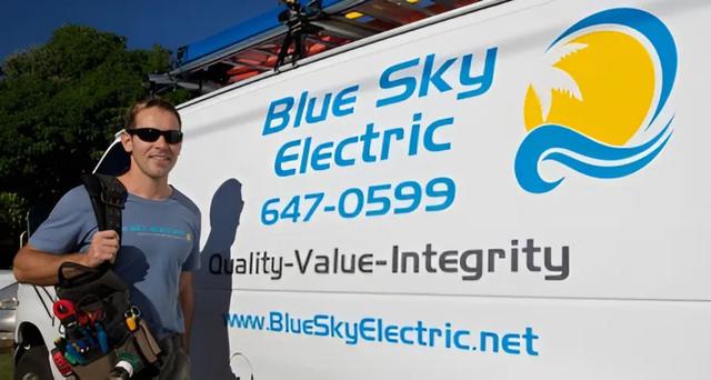 Blue Sky Electric owner with company work van on Kauai.